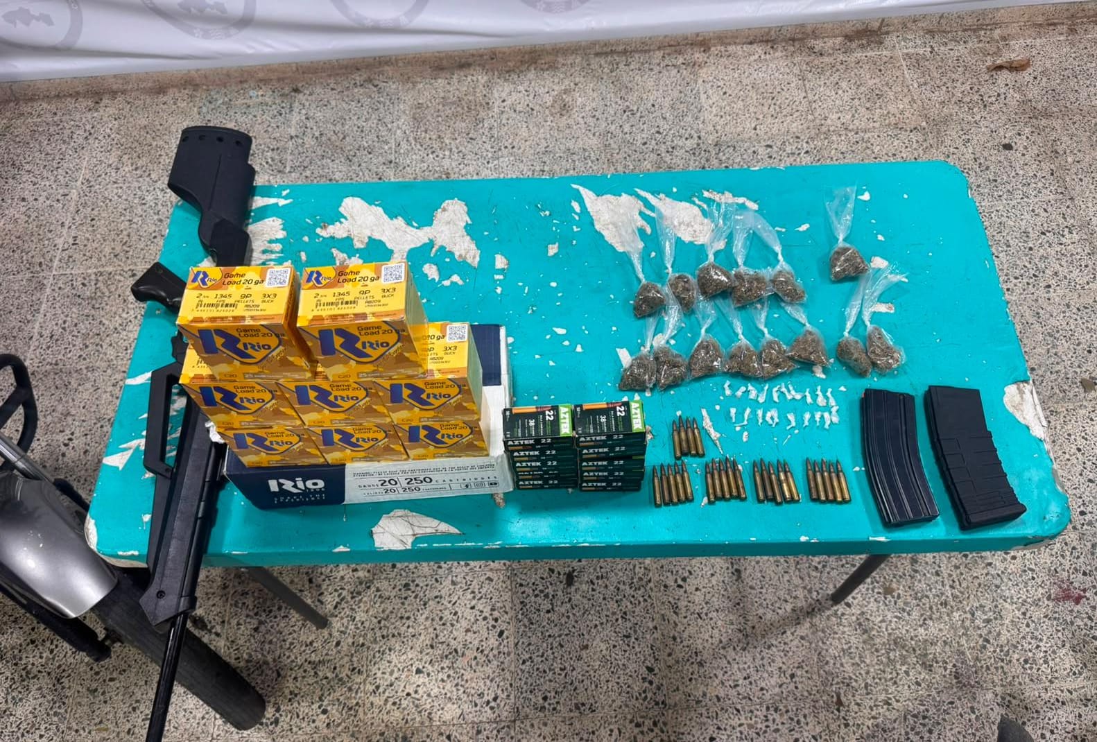 FGR investiga a dos detenidos por portar arma, más de mil cartuchos y presuntas drogas en Emiliano Zapata